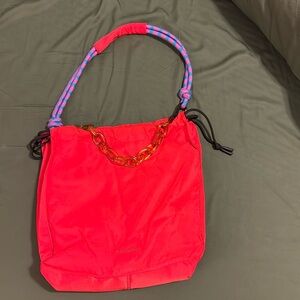 Brand new red rotunda bag never used